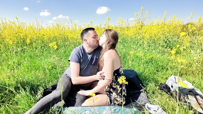Romantic doggy le in a field