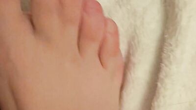 Putting lotion on my tiny, pale feet after showing them off in my favourite socks