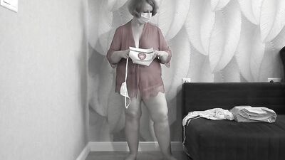 Mature BBW MILF tries on a nurse uniform.