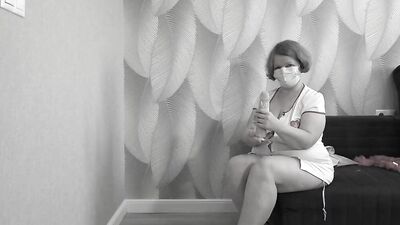 Mature BBW MILF tries on a nurse uniform.