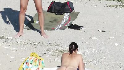 Check out these hot blonde MILFs getting naked on hidden cam in the nude beach