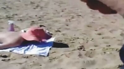 Creepy guy jerks off and jizzes on sunbathing naked girl
