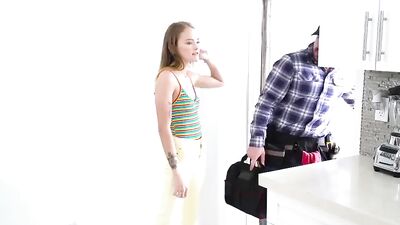 Slutty chick rides a plumber while he is trying to work
