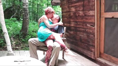 Redhead MILF is riding hard cock at the house porch