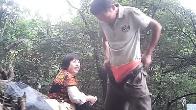 Asian mom gets super wet when fucking in the woods
