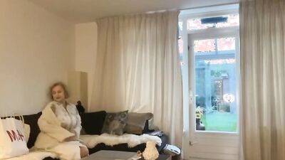 Seductive curvy mom Karina is undressing and posing on the couch