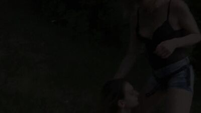 Lezdom dominates and humiliates her slavegirl in the open air