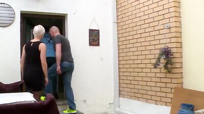 Busty blonde cougar blows two guys and gets fucked by both