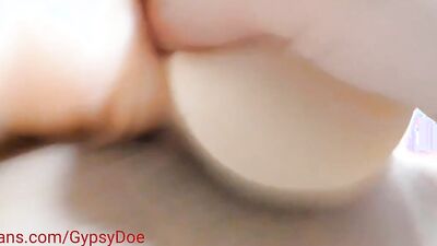 Chubby woman is stimulating her big clit with a special sex toy