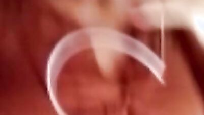 Chubby mature woman is talking dirty while masturbating over the camera