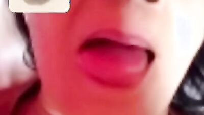 Chubby mature woman is talking dirty while masturbating over the camera