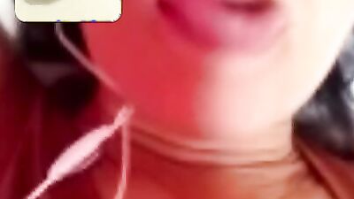 Chubby mature woman is talking dirty while masturbating over the camera