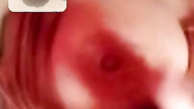 Chubby mature woman is talking dirty while masturbating over the camera