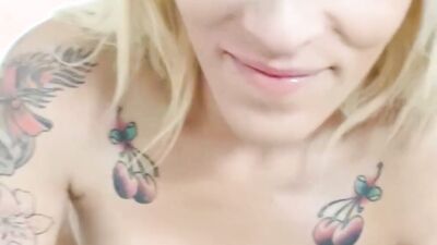 Inked blonde Jordanne Kali flirts with the camera while being fucked