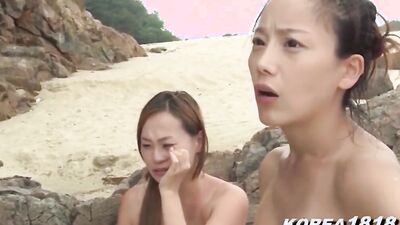 Naughty Asian babes are dancing fully naked on the beach