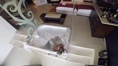 Horny couple is having steamy sex in a hot bathtub
