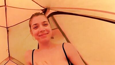 Amateur girl is playing with her wet cunt in the tent