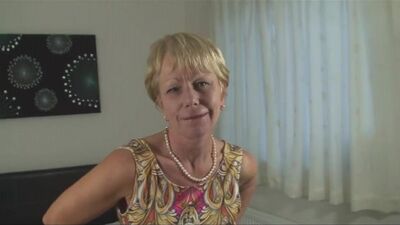 Busty mature woman squeezes her awesome tits and rubs wet pussy