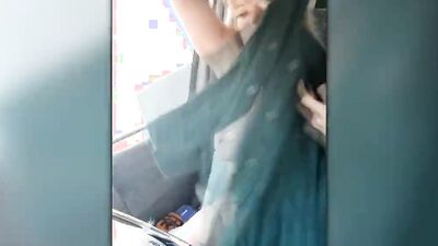 Blonde MILF gets horny driving the car and plays with herself
