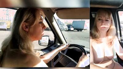 Blonde MILF gets horny driving the car and plays with herself
