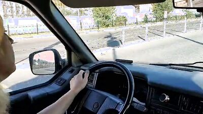 Blonde MILF gets horny driving the car and plays with herself