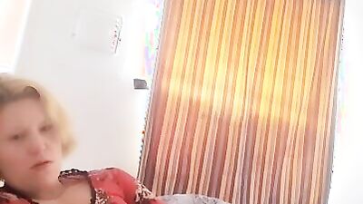 Mature woman gives some jerk off instructions and plays with herself