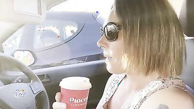 Hitchhiker MILF grabs driver's cock and blows him in the car