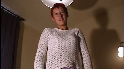 Short-haired girl gets naked and plays with her pussy