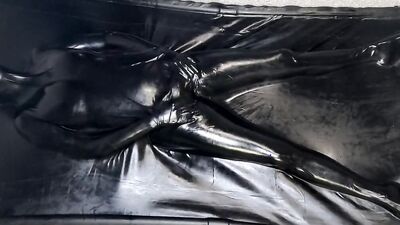 Helpless MILF in latex is being stimulated with a Hitachi magic wand