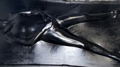 Helpless MILF in latex is being stimulated with a Hitachi magic wand