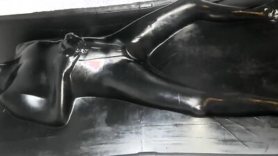 Helpless MILF in latex is being stimulated with a Hitachi magic wand