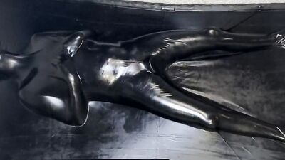 Helpless MILF in latex is being stimulated with a Hitachi magic wand