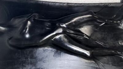 Helpless MILF in latex is being stimulated with a Hitachi magic wand