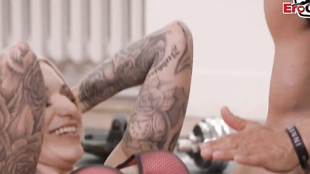 Tattooed blonde bombshell is fucked by a horny fitness instructor
