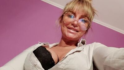 Mistress Zabava talks dirty while cock-teasing on the couch