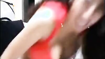 Curly-haired MILF is playing with herself in front of the camera