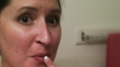 Chubby cougar is stretching her cunt with a massive sex toy