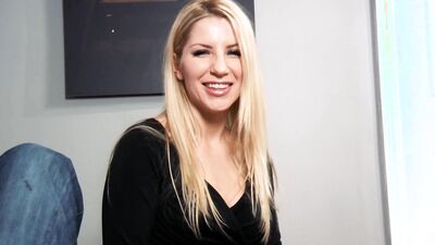 Naughty blonde cougar stares at the camera with a dick in her mouth