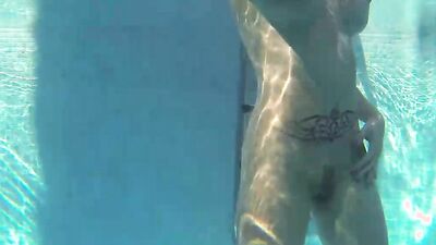 Slutty blonde is sucking a cock while rubbing cunt in the pool