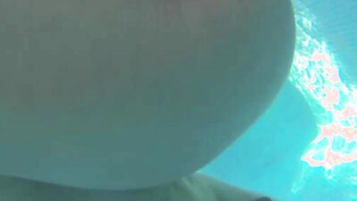 Slutty blonde is sucking a cock while rubbing cunt in the pool