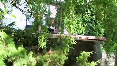 Two slutty girls are making out and sucking cock in the park