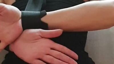 Bound girl kneels down on her master and sucks his hard cock