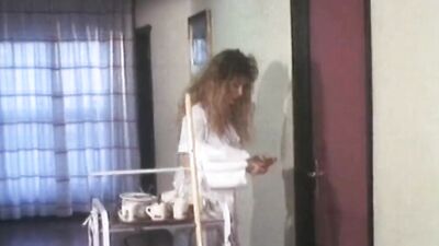 Classic porn video shows a wild brunette fucked by two fellows