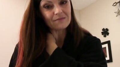 Charming cougar talks dirty and plays with a dildo in POV video