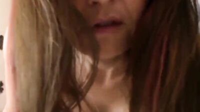 Charming cougar talks dirty and plays with a dildo in POV video
