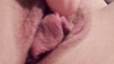 Horny girl is filming her wet pussy from up close while masturbating