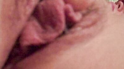 Horny girl is filming her wet pussy from up close while masturbating