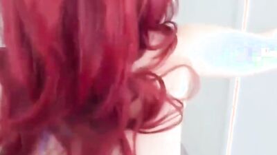 Muscled redhead MILF dances for the camera and gets naked