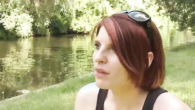 Redhead MILF talks about herself at this outdoor porn interview