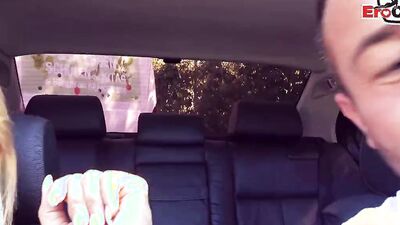 Gorgeous blonde MILF sucks a cock and rides it in the car